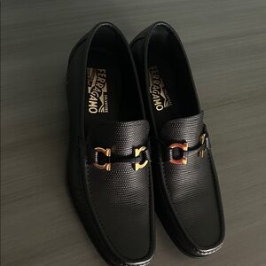 Salvatore Ferragamo Black Textured Loafers with Gold Accents